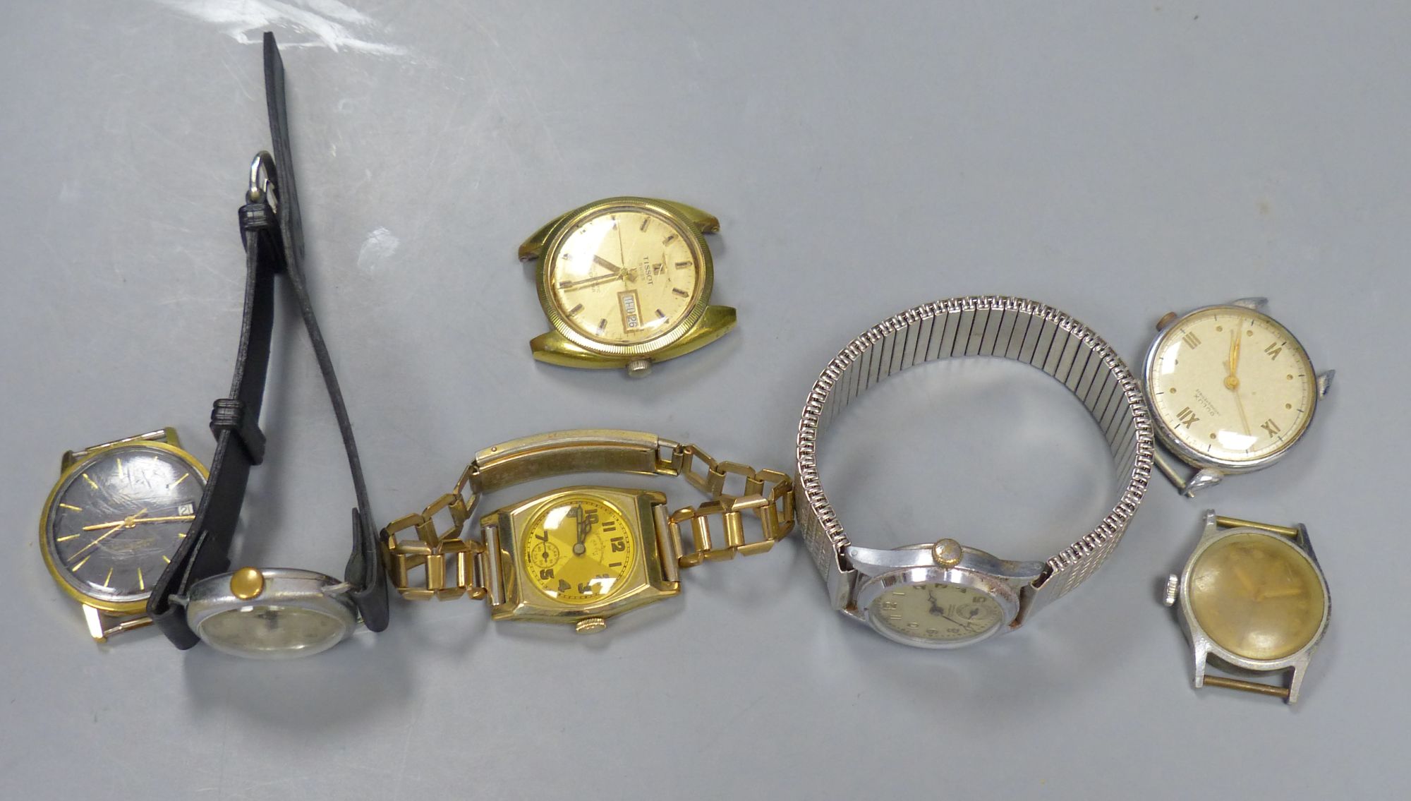 Seven assorted wrist watches including J.W. Benson, Bucherer, Dulux and Tissot.